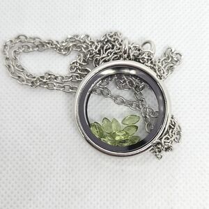 Silver pendant with Peridot marques cut stones. Magnetic clasp